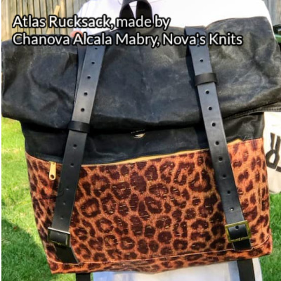 Atlas Rucksack made by Chanova Alcala Mabry from Nova's Knits in leopard print and black cork with buckle straps