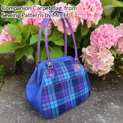 The Companion Carpet Bag from Sewing Patterns by Mrs H made in blue and purple plaid with a blue gusset and purple handles