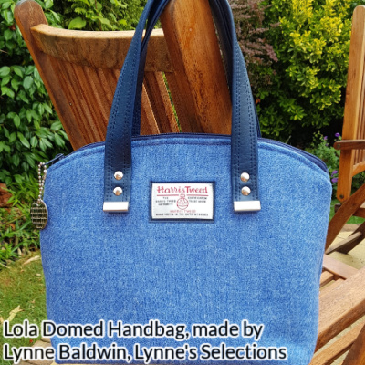 Lola Domed Handbag made by Lynne Baldwin from Lynne's Selections in blue Harris tweed. Pre-made handles are riveted to the bag