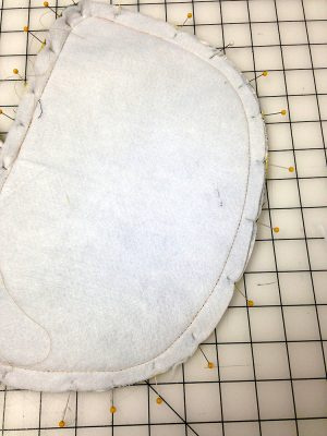 Basting stitches on the back of a bag panel