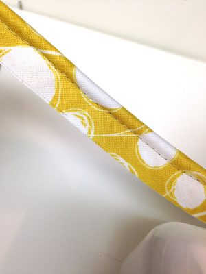 Piping made using yellow fabric patterened with white dots